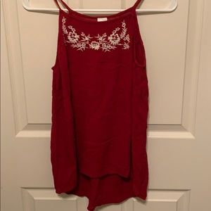 Red tank top with floral embroidery at neckline